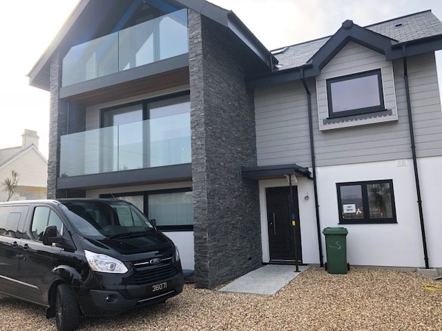 Norstone Charcoal Slimline Stone Veneer Panels used on an exterior feature wall on a residential home in the UK